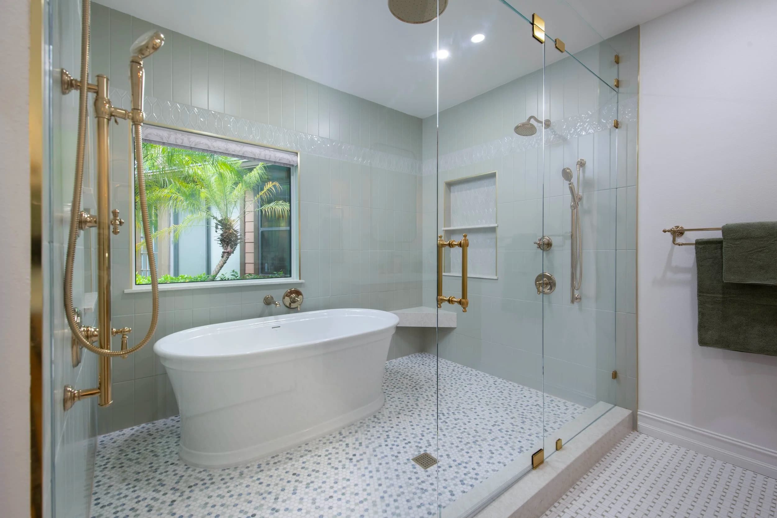 Double vanity with stone countertop and sconces