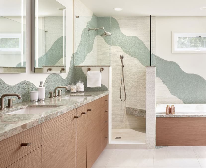 Newly remodeled bathroom with walk-in shower, floating vanity and warm lighting
