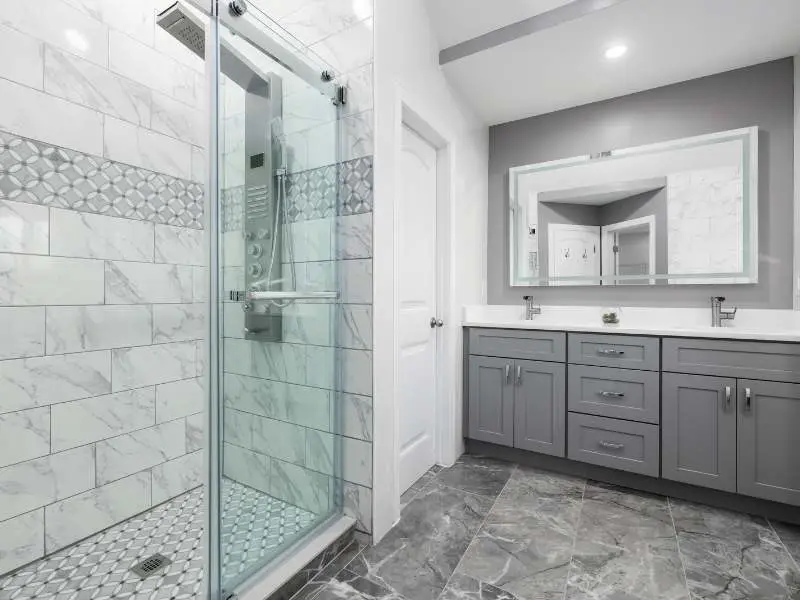 Frameless glass shower with subway tile