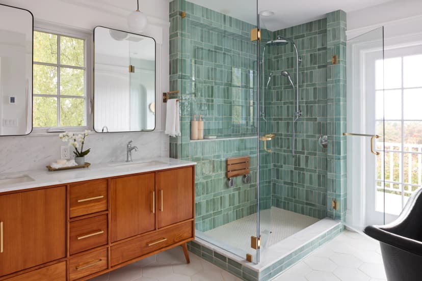 Modern walk-in shower conversion with glass doors and subway tile